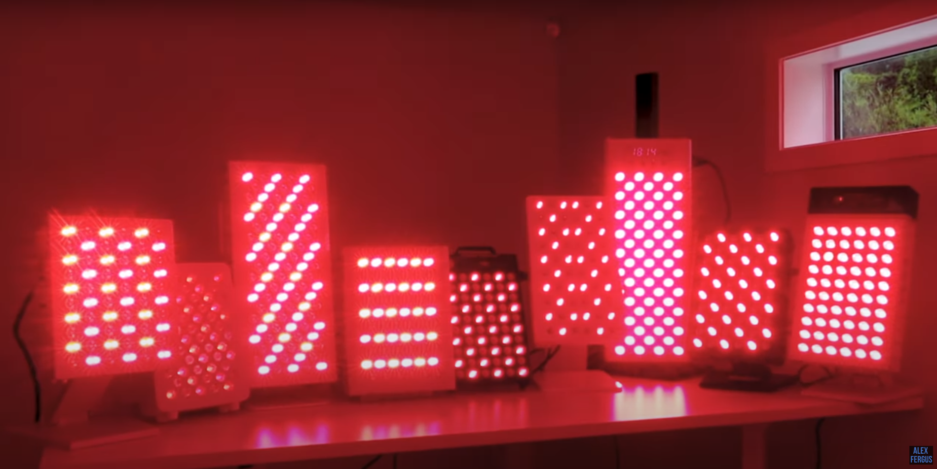 Nine red light therapy tabletop panels lined up for the contest